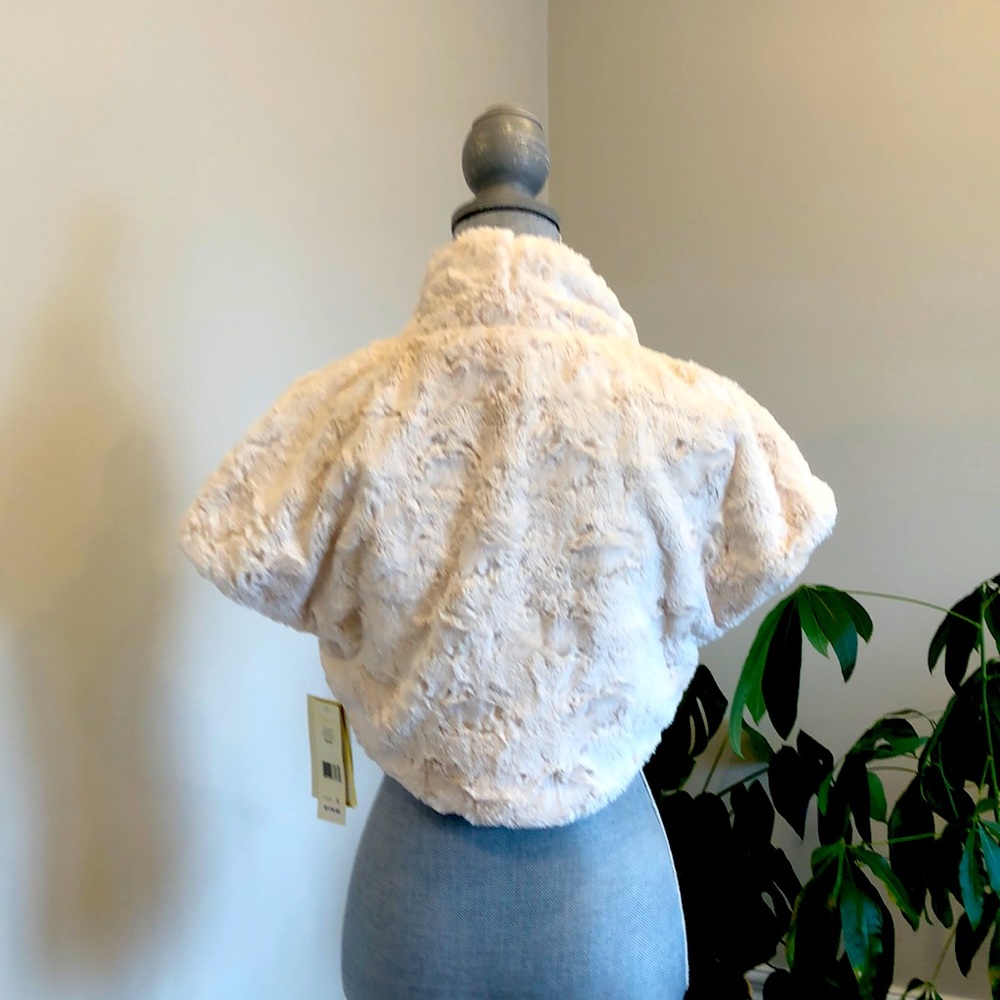 NWT- Make a statement with this beautiful bolo shrug, that is luxuriously soft.